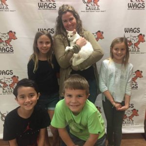 happy family adopt a cat at WAGS