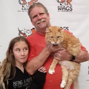 little girl is happy in her new cat adoption WAGS