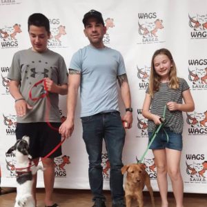 great kids and dad adopt pet at WAGS