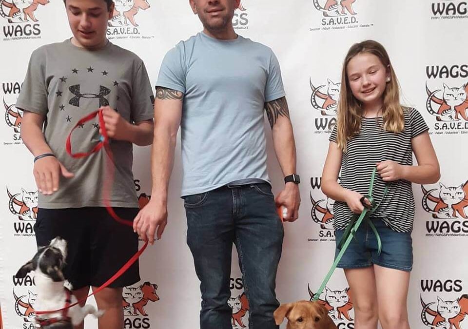 great kids and dad adopt pet at WAGS