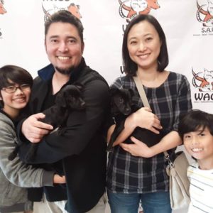 happy kids adopt a puppy at WAGS