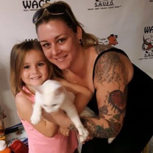 sweet little girl adopt a cat WAGS