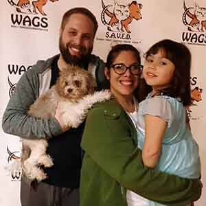 family happy in their new pet adopt wags