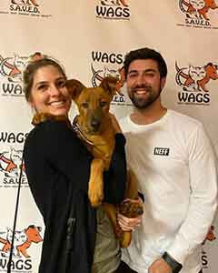 happy couple adopt a dog at WAGS