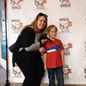 sweet child and her mother adopt a cat wags