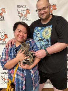 holding adopted wags cat