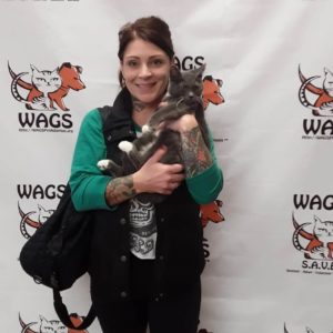 tattooed woman adopt gray cat wags 